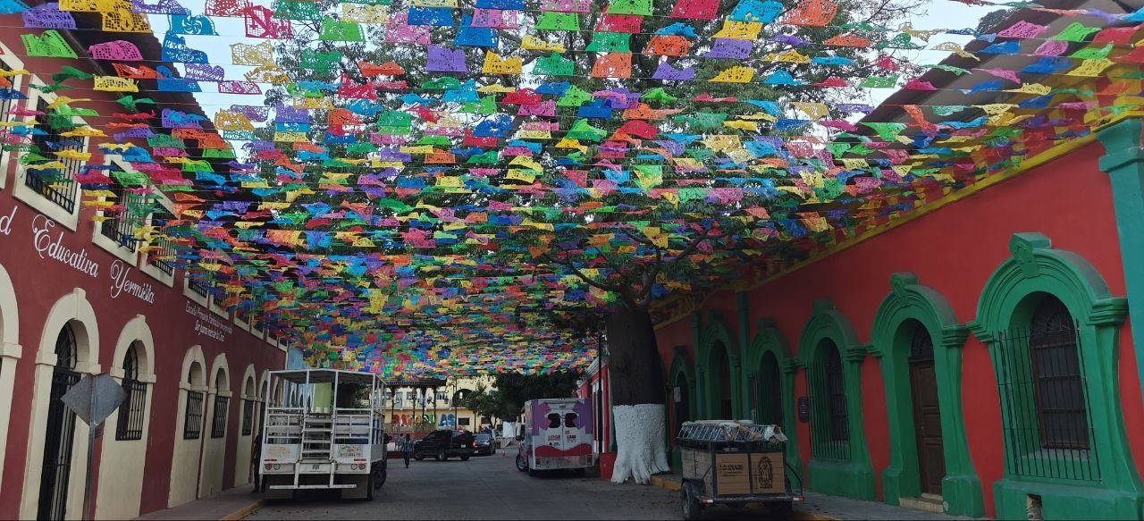 Colorful town street with papel picado